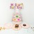 Four layer pink cake rack  + $1.10 