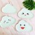 8 white cloud disks with green smiling faces 