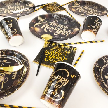 Happy New Year themed party supplies, black and gold paper cups, tissues, tableware, party decorations